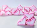 A cluster of heart-shaped marshmallows in pink and white tones, arranged with depth and warmth on a clean surface Royalty Free Stock Photo