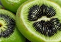 A cluster of kiwi fruit was cut open to reveal the emerald green flesh speckled with tiny black seeds.
