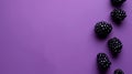 Blackberries rest invitingly atop a rich purple canvas