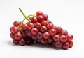 A cluster of red grapes (Vitis vinifera) is arranged on a plain white background. The Royalty Free Stock Photo
