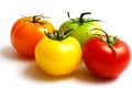 Cluster of red yellow orange and green tomatoes Royalty Free Stock Photo