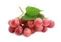 Cluster of ripe red grapes with green leaf on white background Royalty Free Stock Photo