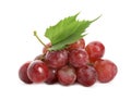 Cluster of ripe red grapes with green leaf on white background Royalty Free Stock Photo