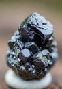 Cluster of shiny, dark iron oxide hematite (Fe?O?) crystals. The crystals are hexagonal, Royalty Free Stock Photo