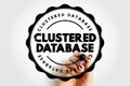 CLUSTERED DATABASE stamp graphic with a hand holding a marker, featuring a circular badge and bold distressed title, suitable for Royalty Free Stock Photo