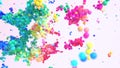 Clusters of multicolored particles isolated on white close up