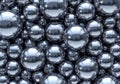 Clusters of reflective silver spheres of varying sizes tightly packed Royalty Free Stock Photo