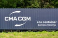 CMA CGM eco containter on a trailer truck wth bamboo flooring Royalty Free Stock Photo