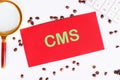 CMS (Content Management System) acronym on a red card Royalty Free Stock Photo