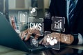 CMS - Content management system concept.Businessman using laptop to management cms software for publishing content.Blog promotion