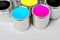 CMYK color paint tin cans opened top view Royalty Free Stock Photo