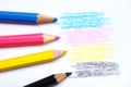 Cmyk concept - wooden crayon texture with cyan blue red magenta yellow and black drawings on white paper background Royalty Free Stock Photo