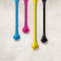 Cmyk ink drops on white concrete square background Royalty Free Stock Photo