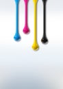 Cmyk ink drops on white paper background Royalty Free Stock Photo