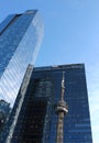 CN Tower reflected in Marsh & McLennan skyscraper in Toronto. Royalty Free Stock Photo