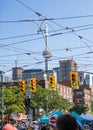 The CN Tower seen through street lights and streetcar cables on Dundas near Chinatown