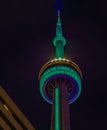 Close up top of CN tower at night. Smudgy clouds. Royalty Free Stock Photo