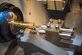 The CNC lathe machine drilling the small brass