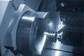 The  CNC lathe machine groove cutting the metal pulley parts. Royalty Free Stock Photo