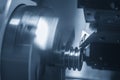 The CNC lathe machine groove cutting the metal pulley parts. Royalty Free Stock Photo