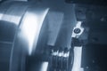 The CNC lathe machine groove cutting the metal pulley parts. Royalty Free Stock Photo