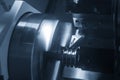The CNC lathe machine groove cutting the metal pulley parts with lighting effect. Royalty Free Stock Photo