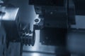 The CNC lathe machine  groove cutting the pulley parts by cutting tool  . Royalty Free Stock Photo