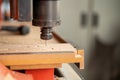 CNC Lathe machine working on wood to lathe and shaping Royalty Free Stock Photo