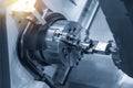 The CNC lathe or turning machine use the robot arm Royalty Free Stock Photo