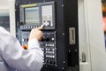 CNC machine operator working with a control panel Royalty Free Stock Photo