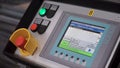 Cnc machine touch controls. Remote Panel Of Print Machine With Red Button. Clip. Hand of worker, modern equipment