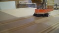 The CNC machine is working. Close-up of a numerical control machine cuts a tree. CNC tool. The machine cuts a drawing on a wooden