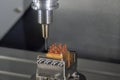 The CNC milling machine cutting the copper electrode parts with solid ball end mill tool