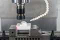 The CNC milling machine cutting the POM material part by solid ball end-mill tool. Royalty Free Stock Photo