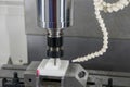 The CNC milling machine cutting the POM material parts by solid ball endmill tool Royalty Free Stock Photo