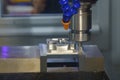 The CNC milling machine rough cutting the aluminum housing with flat end mill tool Royalty Free Stock Photo