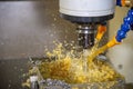 The CNC milling machine rough cutting the mold and die parts with oil coolant. Royalty Free Stock Photo