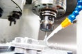 CNC milling machine work. Coolant and lubrication in metalwork industry Royalty Free Stock Photo