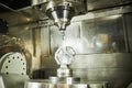 CNC milling machine work. Five axis machining in metalwork industry