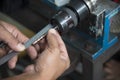The CNC operator measure the tool length of endmill tool