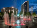 CNN Building, Centennial Olympic Park, and the Olympic Rings Fountain just after sunset.