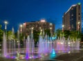 CNN Building, Centennial Olympic Park, and the Olympic Rings Fountain just after sunset.