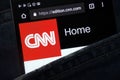 CNN website displayed on smartphone hidden in jeans pocket