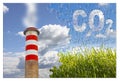 CO2 concept image in jigsaw puzzle shape against a green wild grass on sky background and an high concrete chimney emits fumes Royalty Free Stock Photo