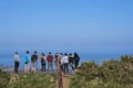 Beautiful bright view of group of teenagers in a row seeing scenic views on Shankill and Irish Sea from Ballycorus Lead Mines