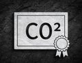 Co2 emissions trading ETS paper symbol stone wall background