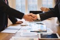 Co-investment business shaking hands successful deal after great meeting.