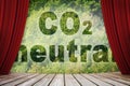 CO2 Neutral text - Carbon neutrality concept against a forest backgound