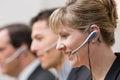Co-workers in headsets working in call center Royalty Free Stock Photo