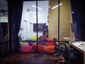 Co working corner open space office with colorful chair,black long tables ,large windows with interior